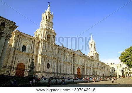 Many People Relaxing In Front Of Basilica Cathedral Of Arequipa, Spectacular Landmark In The Heart O