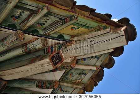 A Typical Example Of Wooden Architecture Of The Era Of Koryo. Corner Of The Roof And Beams With Colo