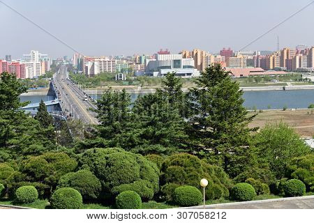 Pyongyang, North Korea - May 1, 2019: View From Above On The Bridge Over Taedong River And New Resid