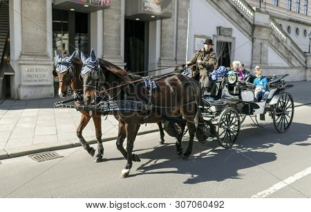 Viena, Austria - March 18, 2019: Horse Cart Rides On The Viennese Street