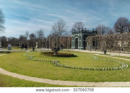 Viena, Austria - March 18, 2019: Picturesque Lawn With Flowers Planted On It Near The Schonbrunn Pal