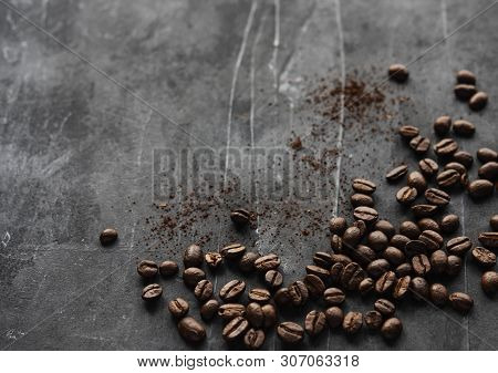 Coffee Beans Scatered On The Gray Background Top View