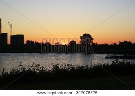 Sunset Or Sunrise In The City. Modern Residential District Near The Pond Of Saint Petersburg, Russia