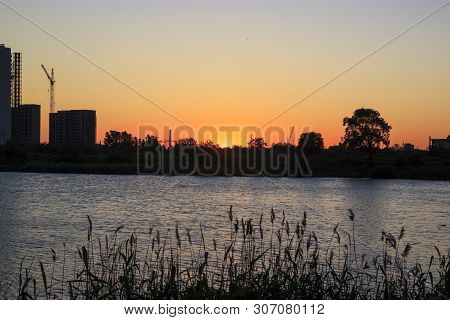 Sunset Or Sunrise In The City. Modern Residential District Near The Pond Of Saint Petersburg, Russia
