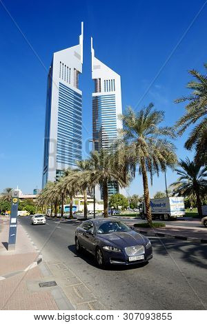 Dubai, Uae - November 19: The Emirates Towers And Jaguar Xf Car On November 19, 2017. The Emirates T