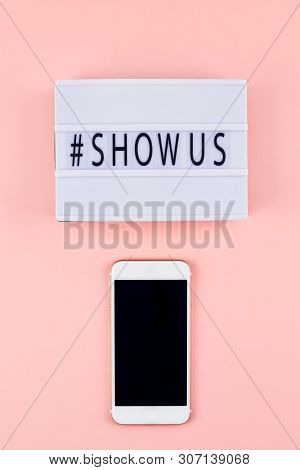 Creative Top View Flat Lay Of Lightbox With Hashtag Show Us Message And Mobile Phone Mockup Pink Bac