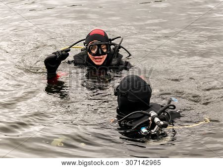 Scuba Diving In A Mountain Lake, Practicing Techniques For Emergency Rescuers. Immersion In Cold Wat