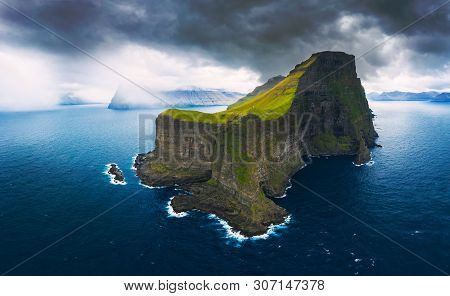 Aerial Panorama Of A Small White Lighthouse Located On The Edge Of A Huge Cliff And The Island Of Ka