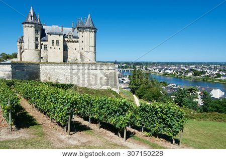 Saumur castle and Loire River, Loire Valley, France.