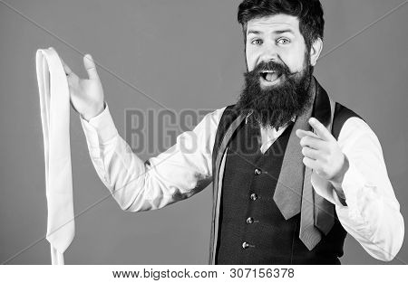 You Should Purchase It. Shop Assistant Pointing Finger And Offering Broad Assortment Of Neckties To 