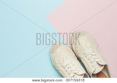 Beige Fashionable Women's Espadrilles On Color Pastel Blue Pink Background. Creative Concept Of Spri