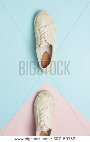 Beige Fashionable Women's Espadrilles On Color Pastel Blue Pink Background. Creative Concept Of Spri
