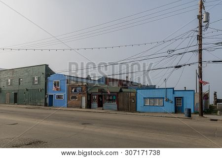 Nome, Alaska - June 8: The Historic Front Street With Bar And Gift Shop On June 8 2019 In Nome Alask