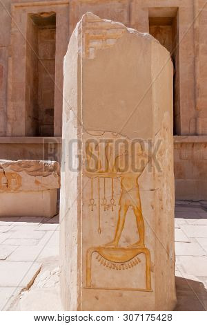 Mortuary Temple Of Hatshepsut In Deir El-bahari. Ancient Wall With The Engraved Egyptian Hieroglyphs