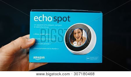 Paris, France - Jun 7, 2019: Man Hand Holding New Amazon Alexa Echo Spot With Personal Assistant Ale