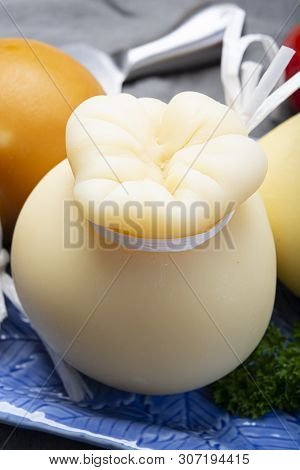 Italian Provolone Caciocavallo Aged And Smoked Cheeses In Teardrop Form Served On Blue Plate Close U