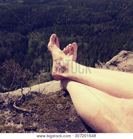Resting Legs Within Mountain Running Trail. Hiker Watching Hilly Landscape Over Own Hairy Legs.