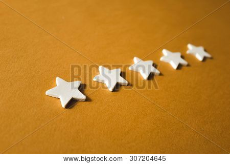 Five White Stars On An Orange Background