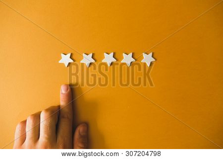 Five White Stars On An Orange Background