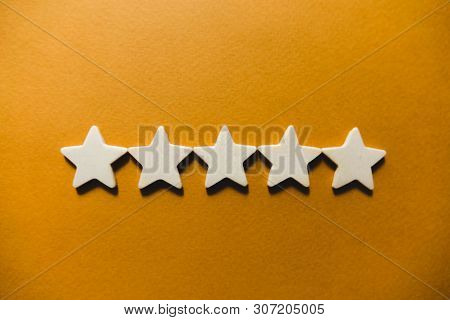 Five White Stars On An Orange Background