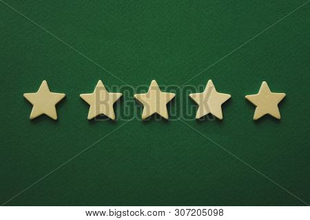 Five White Stars On A Green Background