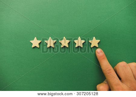 Five White Stars On A Green Background