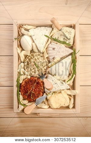 Various Dairy Products. Assorted Cheeses In A Wooden Box. Circassian Curd Cheese. Top View.