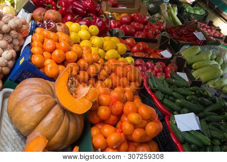 Pumpkin And Apelsins And Other Vegetables In Sale In Outdoor Farmer Market