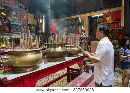 Kuala Lumpur, Malaysia. January 2019.   Believers Pray In Front Of The Altar In Sin Sze Si Ya Temple