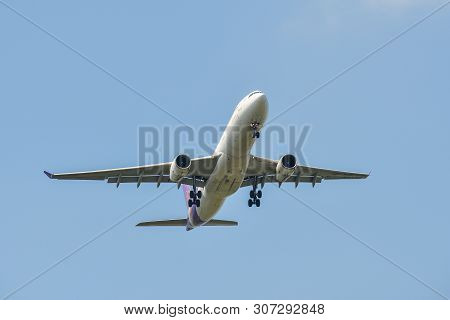 Airplane Landing At The Airport