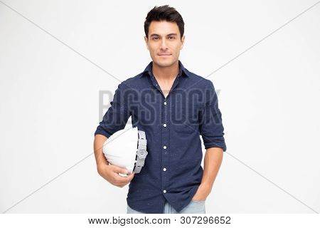 Handsome Man Industrial Engineer Holding A White Helmet Under His Arm Isolated On White Background