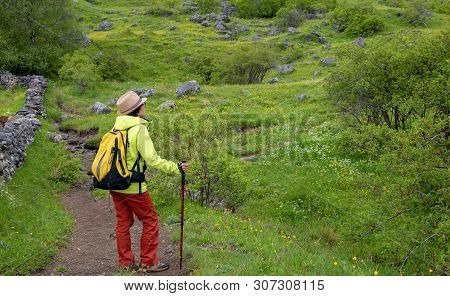 An Hiker Woman With View Of Tena Valley In The Pyrenees, Formigal,  Huesca, Spain