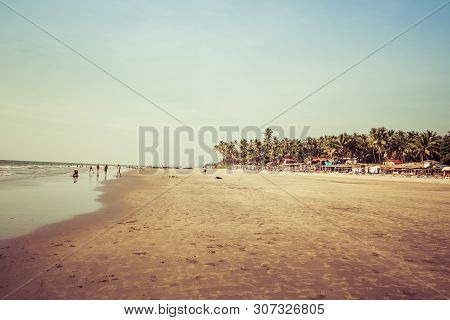 Goa, India - December 20, 2018: View Of The Morjim Beach. Beach Life