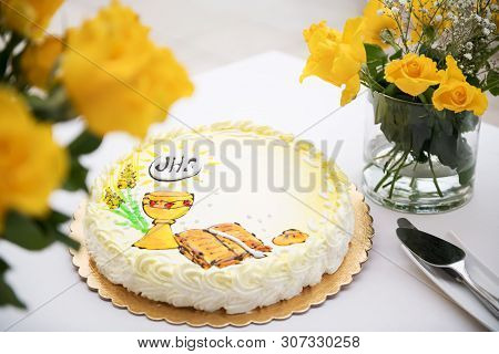 First Holy Communion Concept, Beautiful Cake With First Holy Communion And Yellow Roses On A White T