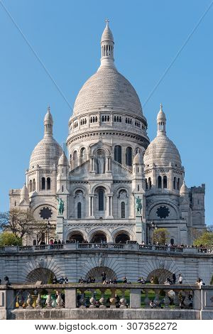 Paris, France - April 12, 2019 : The Basilica Of The Sacre Coeur In The Hill Of Montmartre On A Sunn