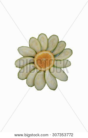 Slices Of Orange And Zucchini In The Shape Of A Flower, Isolated On A White Background. Chamomile Of