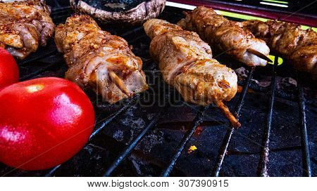 Bbq: Chicken Souvlaki And Red Tomatoes Cooking On A Very Hot Grill.