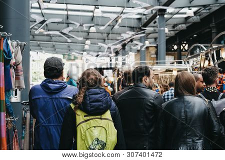 London, Uk - June 15, 2019: People Walking Between The Stalls Inside Spitalfields Market, One Of The