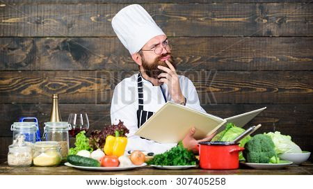 Culinary Arts Concept. Man Learn Recipe. Try Something New. Cookery On My Mind. Improve Cooking Skil
