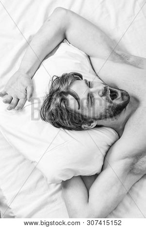 Man Handsome Guy Lay In Bed. Get Adequate And Consistent Amount Of Sleep Every Night. Expert Tips On