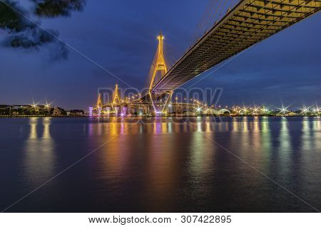 Bhumibol Bridge, Chao Phraya River Bridge. Turn On The Lights In Many Colors At Night.