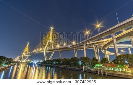 Bhumibol Bridge, Chao Phraya River Bridge. Turn On The Lights In Many Colors At Night.
