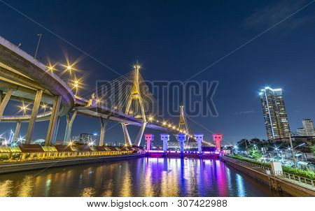 Bhumibol Bridge, Chao Phraya River Bridge. Turn On The Lights In Many Colors At Night.
