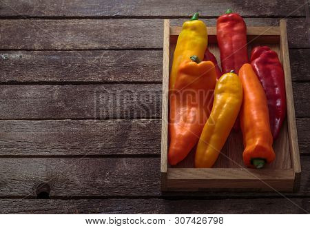 Ripe Colorful Ramiro Peppers Wooden Box Copy Space