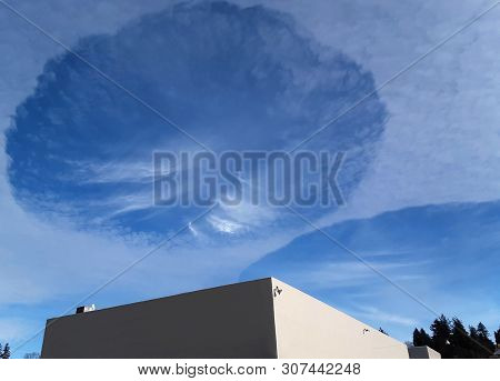 Rare Circluar Clouds In Sky, Called Hole Punch Clouds, Sometimes Known As Fallstreak Holes Are In Th