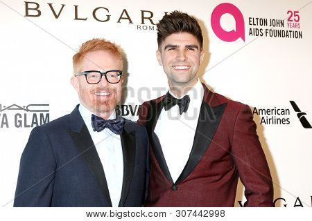 LOS ANGELES - MAR 4: Jesse Tyler Ferguson, Justin Mikita at the 2018 Elton John AIDS Foundation Oscar Viewing Party at the West Hollywood Park on March 4, 2018 in West Hollywood, CA