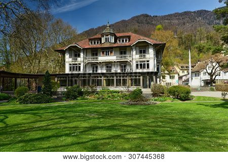 Weesen, Switzerland - April 16, 2019. Beautiful House On The Background Of The Alps On A Sunny Sprin