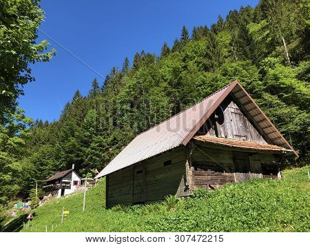 Traditional Architecture And Farmhouse In The Valley Of Wagital Or Waegital And By The Alpine Lake W