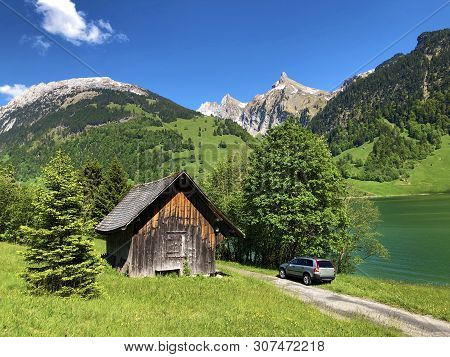 Traditional Architecture And Farmhouse In The Valley Of Wagital Or Waegital And By The Alpine Lake W
