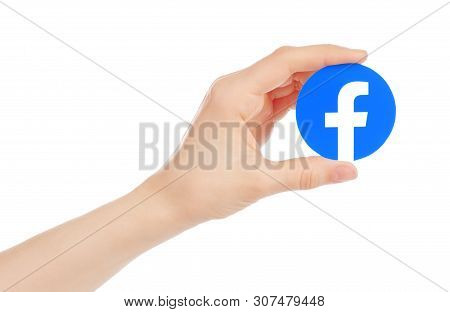 Kiev, Ukraine - May 15, 2019: Hand Holds New Facebook Logo Printed On Paper. Facebook Is A Well-know